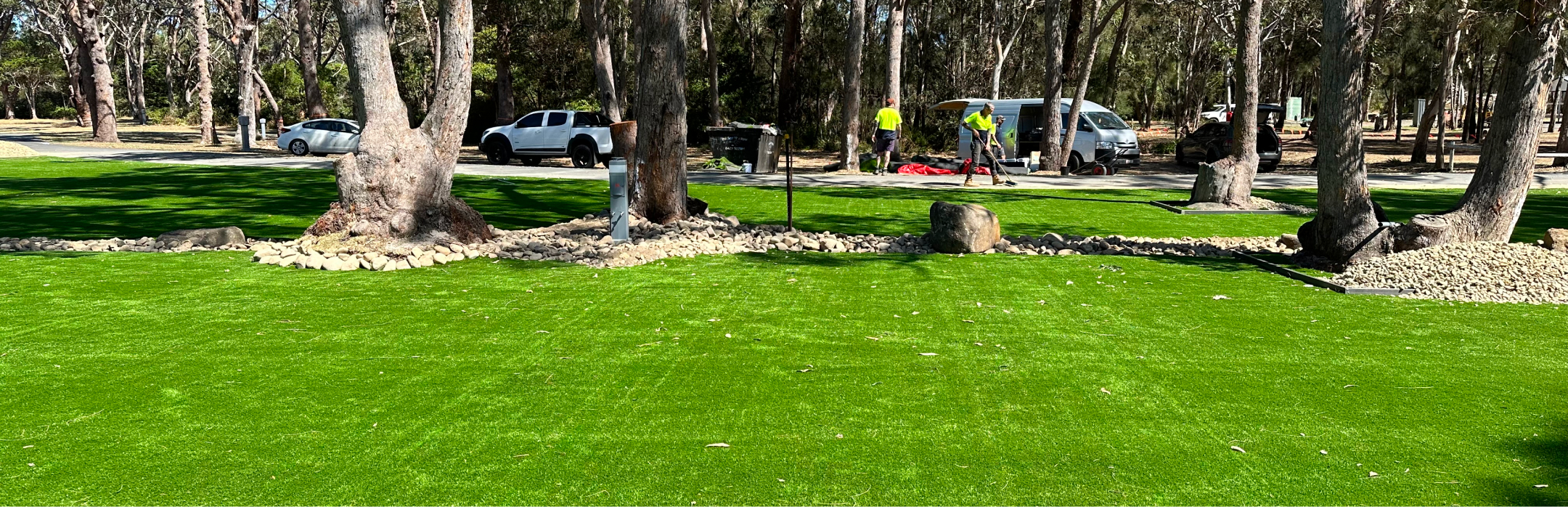 Artificial Turf with spotted trees throughout
